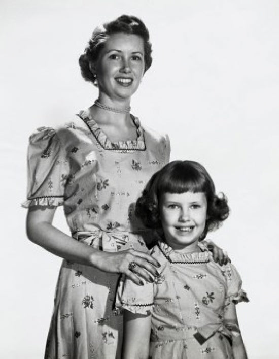 Portrait of a mother smiling with her daughter poster print.