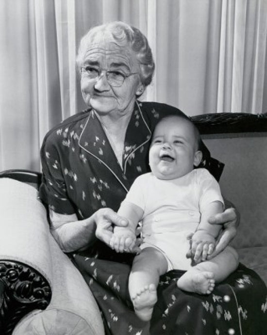 Close-up poster print of a grandmother with her grandson on a couch.