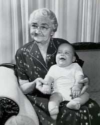 Close-up poster print of a grandmother with her grandson on a couch.