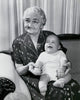 Close-up poster print of a grandmother with her grandson on a couch.