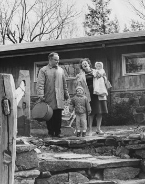 Smiling family poster print featuring parents and two sons.