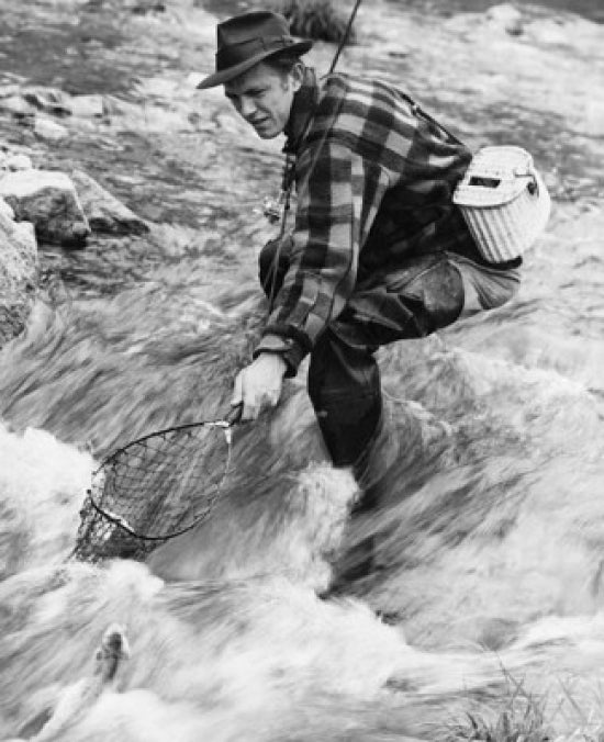 Side profile of a mid-adult man fishing in a river poster print.