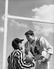 Football player arguing with referee poster print