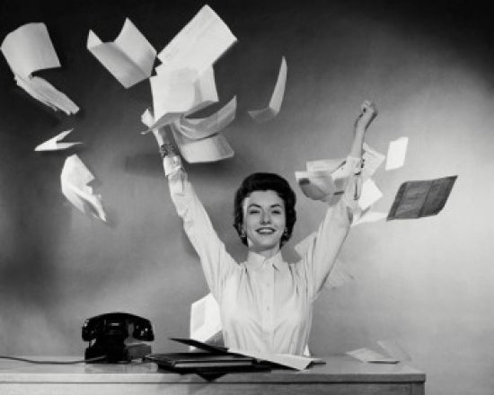 Portrait of businesswoman throwing papers poster print