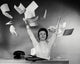 Portrait of businesswoman throwing papers poster print