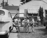 Children Getting Into a Car Poster Print showcasing playful childhood adventure.