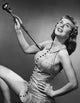 Drum majorette twirling baton poster print showcasing performance energy.