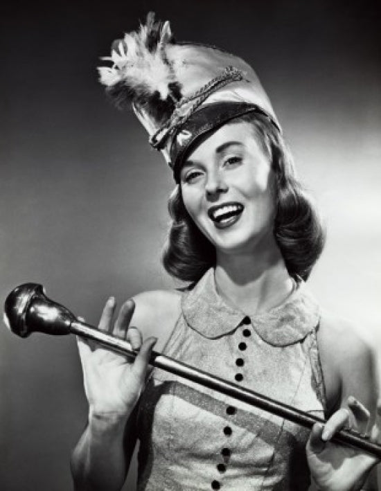 Close-up poster print of a drum majorette smiling and holding a baton.