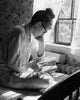 Side Profile of a Young Woman Studying Poster Print showcasing introspection.