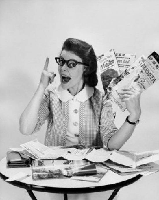Portrait of a mid adult woman holding brochures poster print.