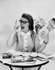 Portrait of a mid adult woman holding brochures poster print.