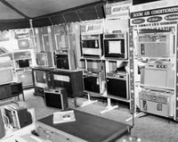 Home Appliances Poster Print featuring modern electronics in vibrant colors.