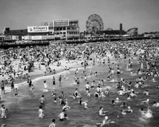 High angle view of tourists enjoying the beach at Coney Island, Brooklyn, New York City.