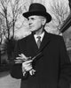 Businessman holding a pipe poster print