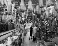 Man with a woman shopping in a grocery store poster print.