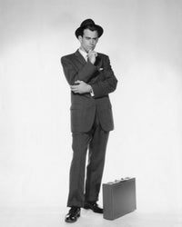 Businessman standing with a briefcase poster print