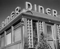 Low angle view of diner sign poster print showcasing vintage Americana style.