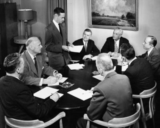 Businessman giving a presentation in a meeting poster print.