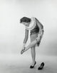 Young Woman Touching Her Ankle Poster Print