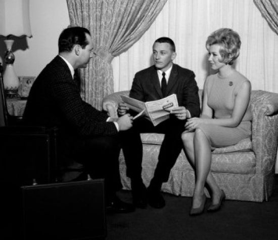 Young couple talking to insurance agent poster print