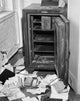 Documents scattered in front of an open safe poster print