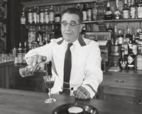 Bartender pouring wine into a wine glass poster print