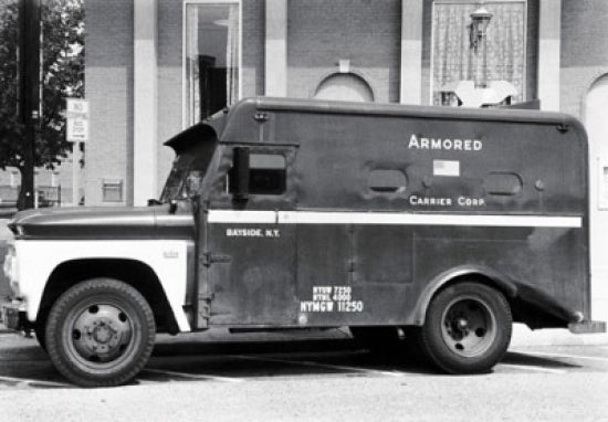 Armored Truck in Front of a Building Poster Print showcasing urban life