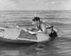 Young man relaxing on an inflatable raft poster print.
