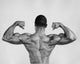 Rear view of a young man flexing his muscles poster print