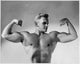 Close-up poster print of a young man flexing his muscles.