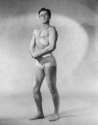 Male body builder flexing muscles poster print showcasing strength and determination.
