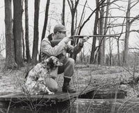 Male Hunter Aiming with Rifle Poster Print on high-quality paper.