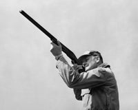 Hunter shooting with a rifle poster print