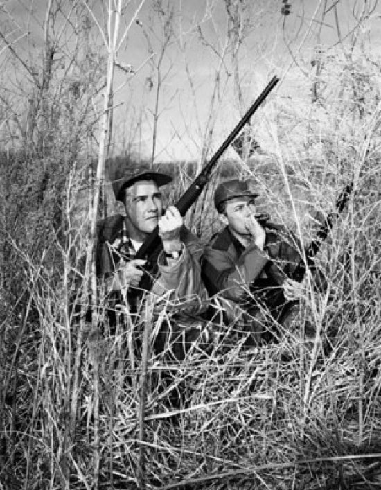 Two young men holding guns hunting poster print