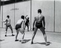 Four People Playing Handball Poster Print showcasing dynamic athleticism.