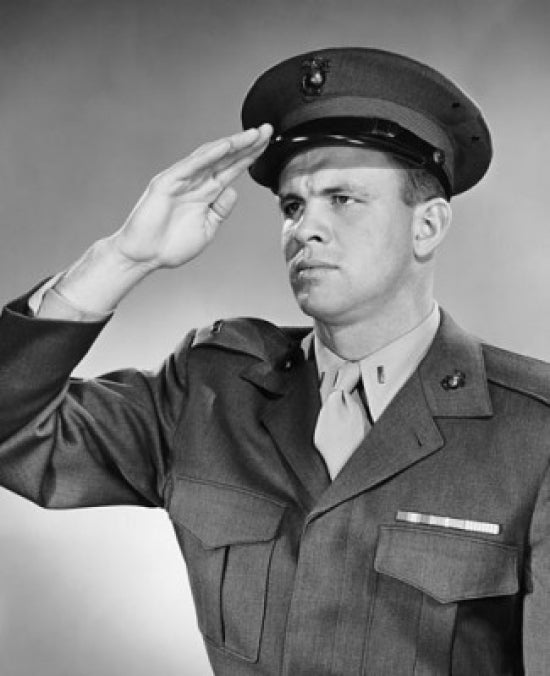 Close-up poster print of an army soldier saluting, honoring military service.