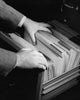 Close-up of a businessman searching for a file poster print.