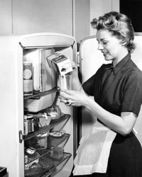 Poster print of a young woman pouring milk into a glass, side profile view.
