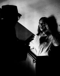 Criminal Threatening Victim in Staircase Poster Print