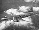Airplane Flying in the Sky Poster Print showcasing aviation beauty.