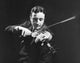 Mid adult man playing a violin poster print
