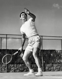Dynamic tennis action poster print featuring a young man playing tennis from a low angle view.