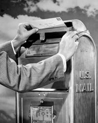 Man's hand dropping mail into a mailbox poster print.