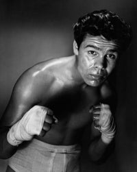 Young adult man in a fighting stance poster print.