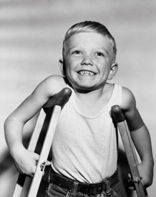 Close-Up of a Boy Standing on Crutches Poster Print