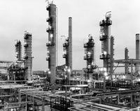 Smoke stacks at Tidewater Oil Company poster print showcasing industrial beauty.