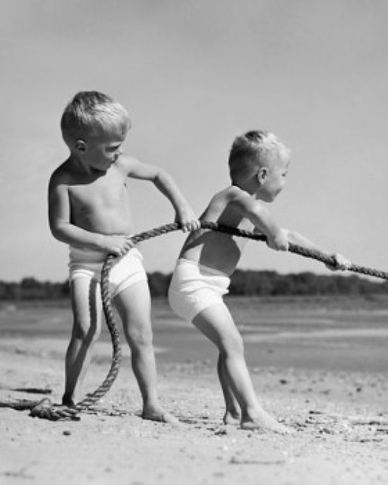 Two Boys Pulling a Rope on the Beach Poster Print