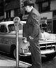 Mid Adult Man Using a Parking Meter Poster Print - Street Photography