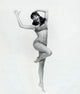 Portrait of a young woman standing on one leg and smiling poster print
