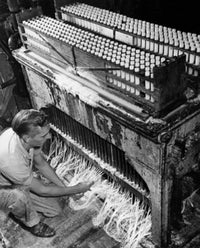 High angle view of a manual worker in a candle factory poster print.